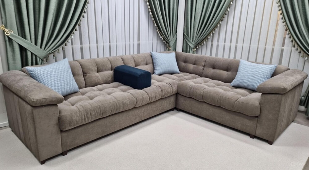 Luxury beige tufted L-shaped corner sectional sofa in modern living room"