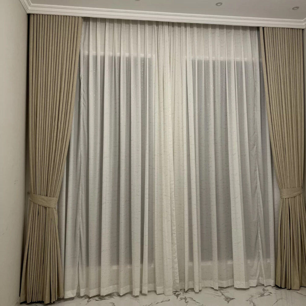 Beige blackout and sheer curtains